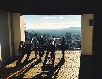 People by sea against buildings in city