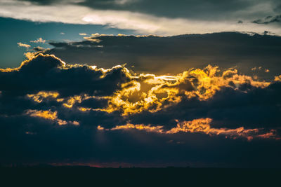Low angle view of dramatic sky during sunset