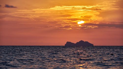 Scenic view of sea against sky during sunset