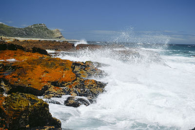 Sea waves splashing on rocks