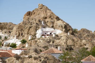 Built structure on mountain against clear sky