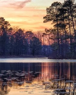 Scenic view of lake against sky during sunset