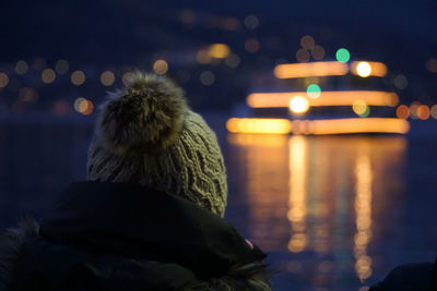 Rear view of illuminated lighting equipment at night