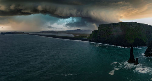 Iceland black sand beach with huge waves at reynisfjara vik.