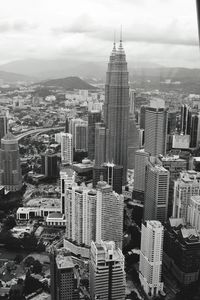 Aerial view of modern buildings in city against sky
