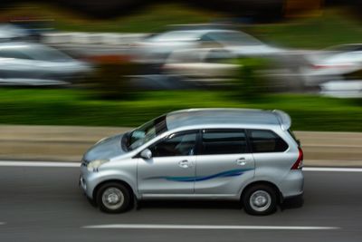 Blurred motion of car on road