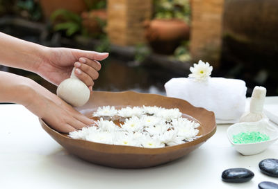 Midsection of person preparing food on table