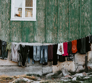 Clothes drying on clothesline against building