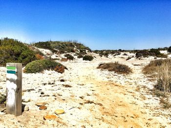 Scenic view of land against clear blue sky