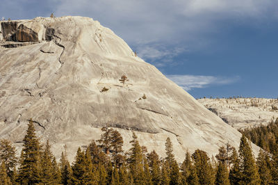 Low angle view of snowcapped mountains against sky