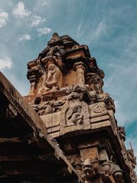 Low angle view of statue of temple against sky