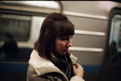 Close-up of woman against train