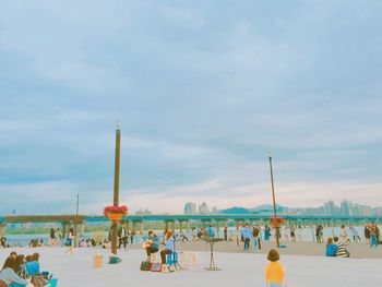 People relaxing on beach