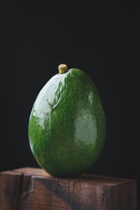 Close-up of apple against black background
