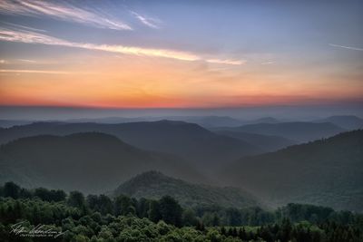 Scenic view of mountains against sky during sunset