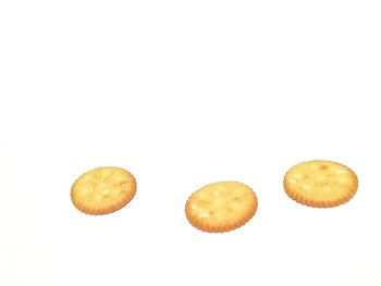 Close-up of cookies against white background