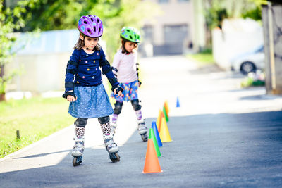 Girls skating on road