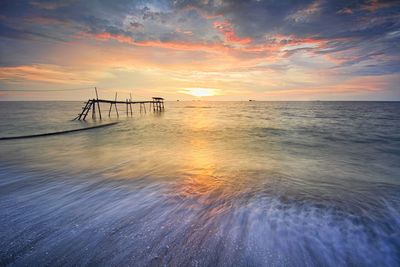 Scenic view of sea against sky during sunset