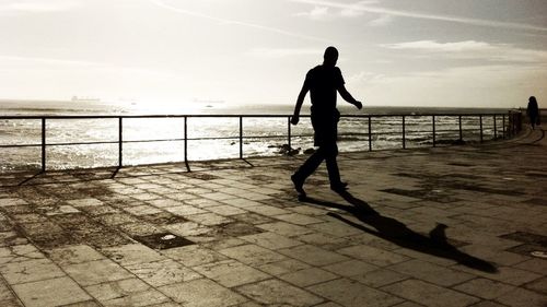 Silhouette of woman in sea