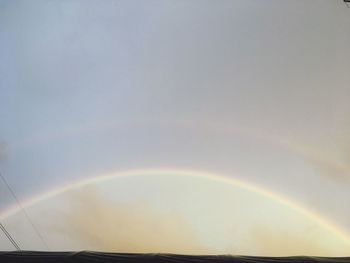 Low angle view of rainbow against sky