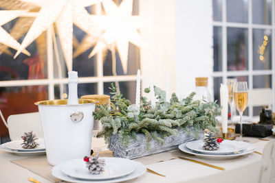 Table served for christmas dinner in living room, close-up view, table setting