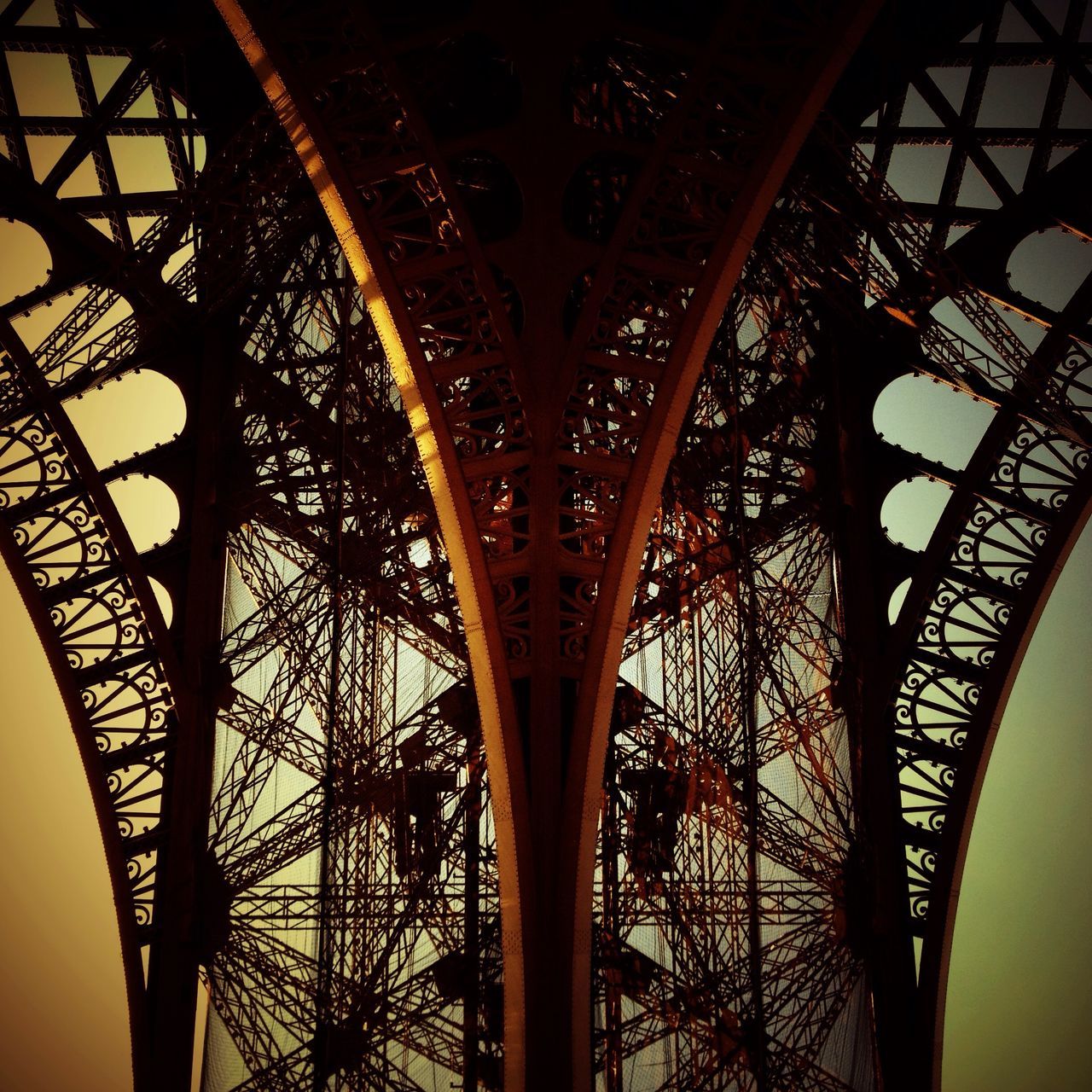 built structure, architecture, low angle view, connection, bridge - man made structure, metal, sky, arch, engineering, indoors, tree, no people, famous place, travel destinations, day, silhouette, architectural feature, international landmark, culture
