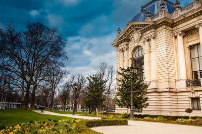 Low angle view of building against cloudy sky