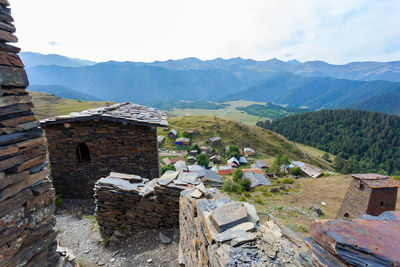 High angle view of buildings and mountains against sky