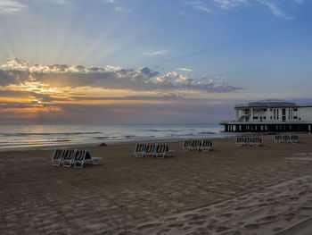 Scenic view of beach against sky during sunset