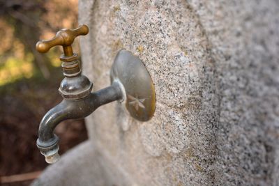 Close-up of water faucet in wall