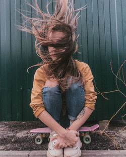 Woman standing against wall