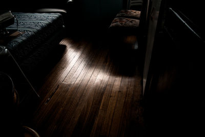 Close-up of chair on hardwood floor at home