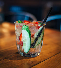 Close-up of gin tonic in glass on table