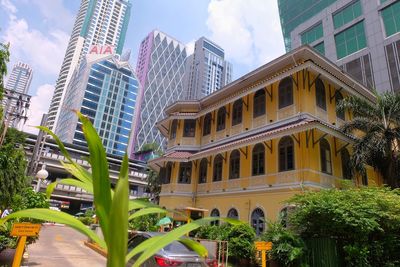 Low angle view of buildings against sky in city