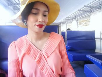 Smiling woman sitting in train