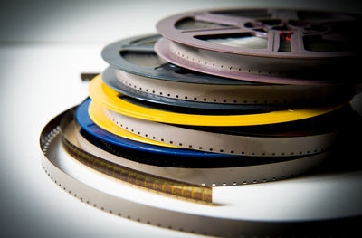 Close-up of film reels over white background