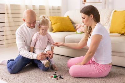 Family using digital tablet at home