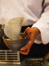 Close-up of man preparing food