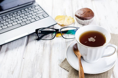 High angle view of coffee cup on table