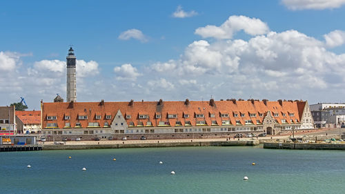 View of buildings against cloudy sky