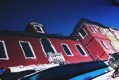 Low angle view of building against blue sky