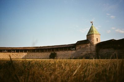 An old castle against a clear sky on a summer day