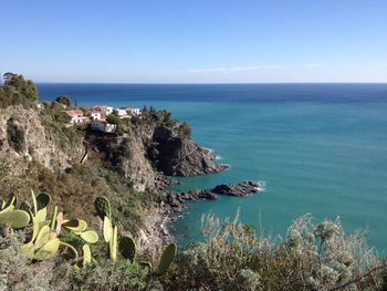 Scenic view of sea against clear blue sky