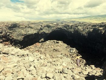 Aerial view of rocks on land against sky