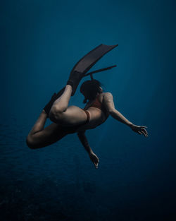 Full length of woman swimming undersea