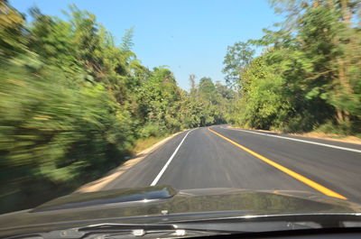 Road seen through car windshield