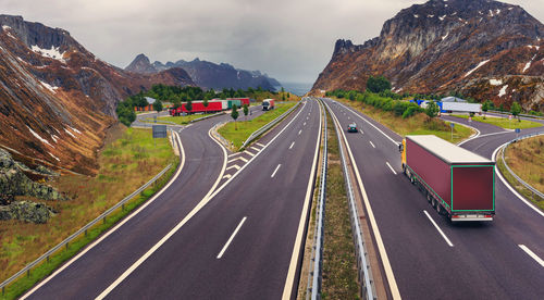 High angle view of highway amidst mountains against sky