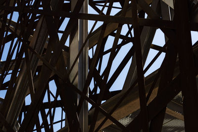 Low angle view of metallic structure against sky