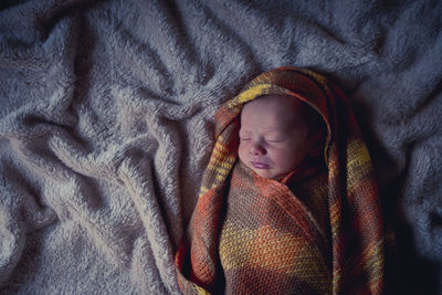 Close-up of a boy sleeping in bed