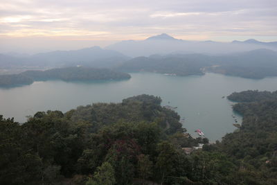 Scenic view of mountains against sky at sunset